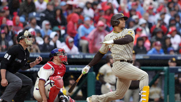 Oct 23, 2022; Philadelphia, Pennsylvania, USA; San Diego Padres right fielder Juan Soto (22) hits a solo home run in the fourth inning during game five of the NLCS against the Philadelphia Phillies for the 2022 MLB Playoffs at Citizens Bank Park. Mandatory Credit: Bill Streicher-USA TODAY Sports